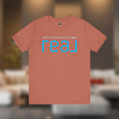 ✨ We Don’t All Look The Same – REAL Tee